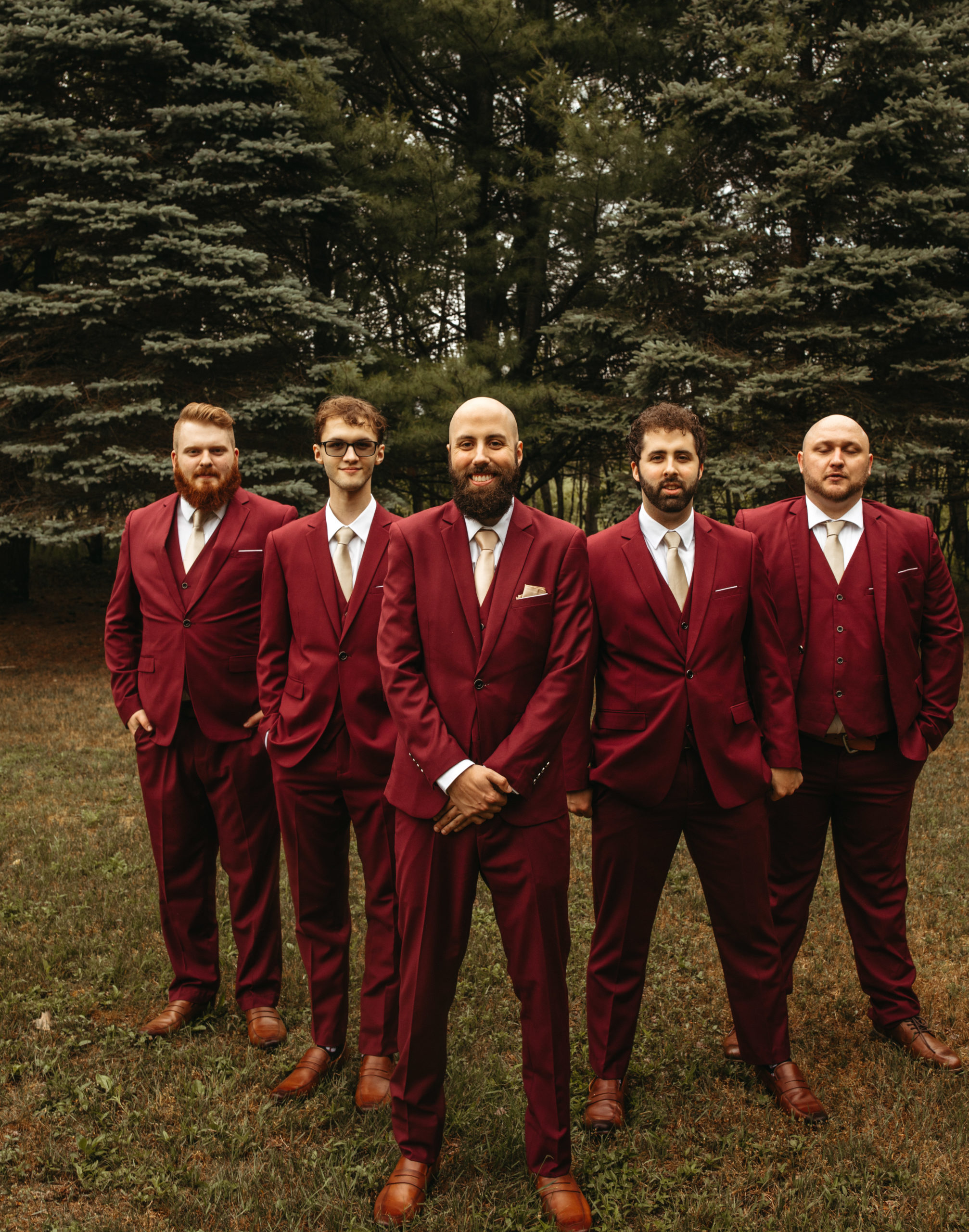 groomsmen wearing burgundy suits for outdoor wedding in Michigan