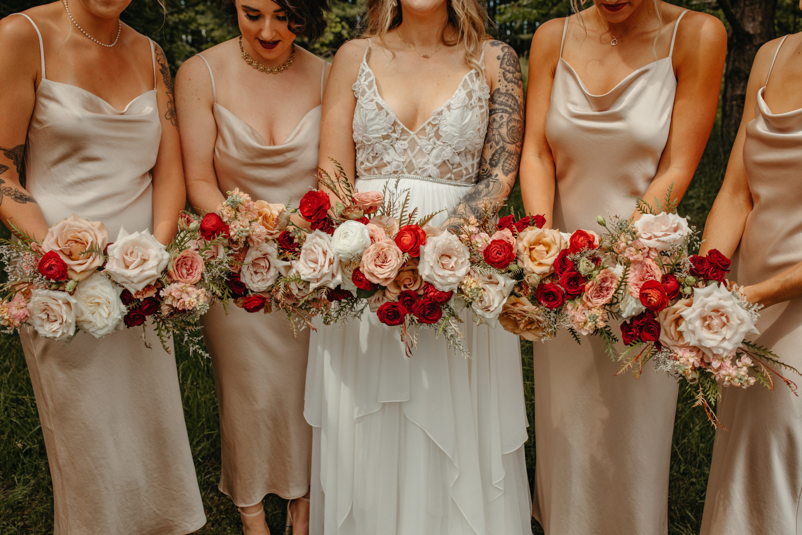 bride and bridesmaid bouquets with rust, burgundy and champagne color palette 
